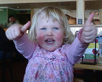 Little girl with thumbs up
