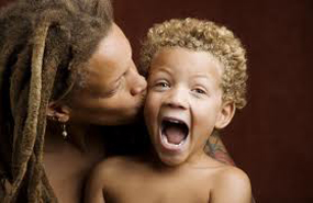 Mom Kiss Son and boy laughs