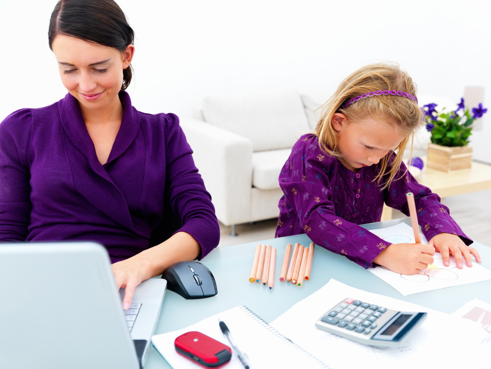 Mom and Daughter working together at a desk